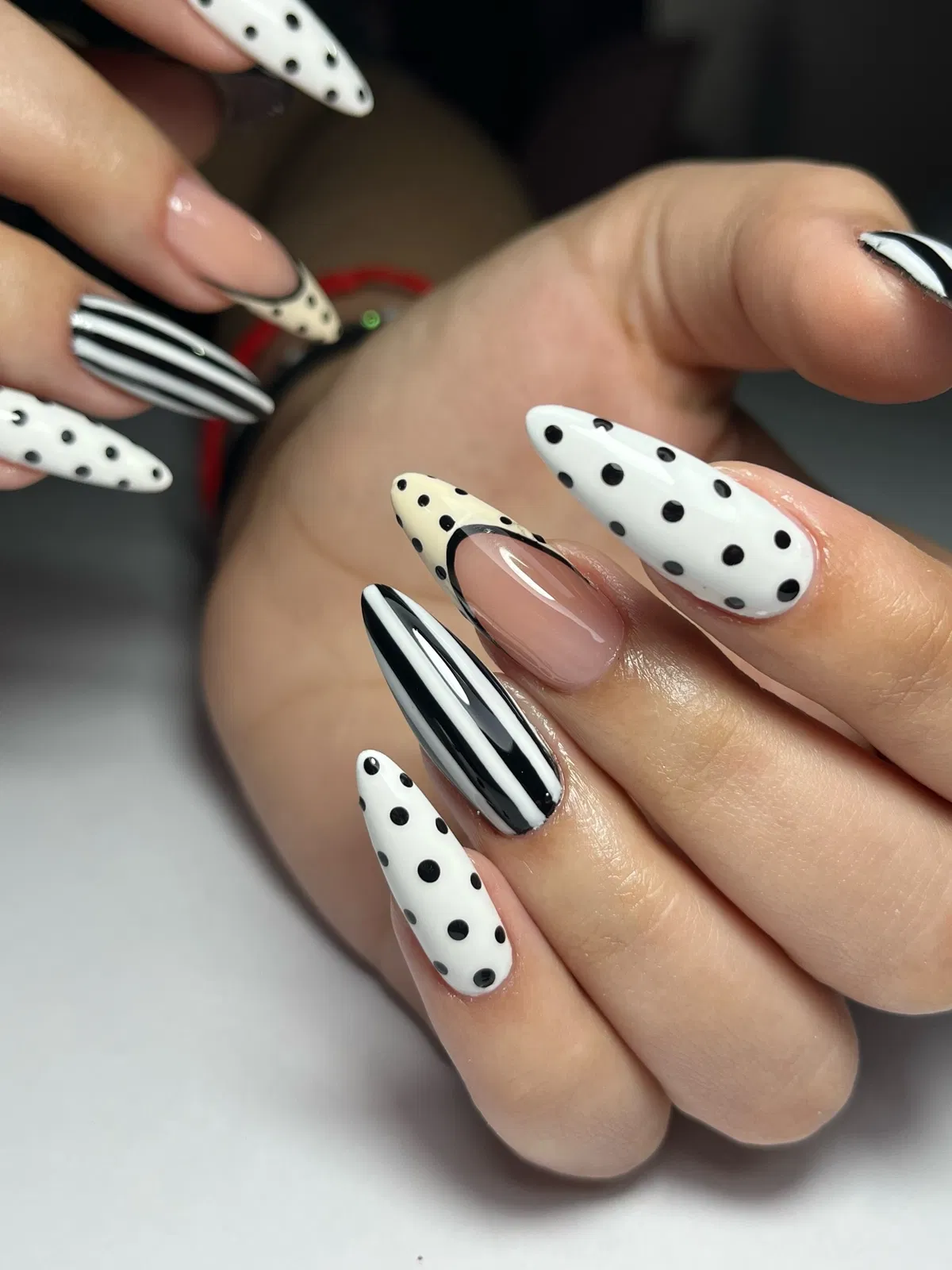 Graphic black-and-white polka dots with stripe accents