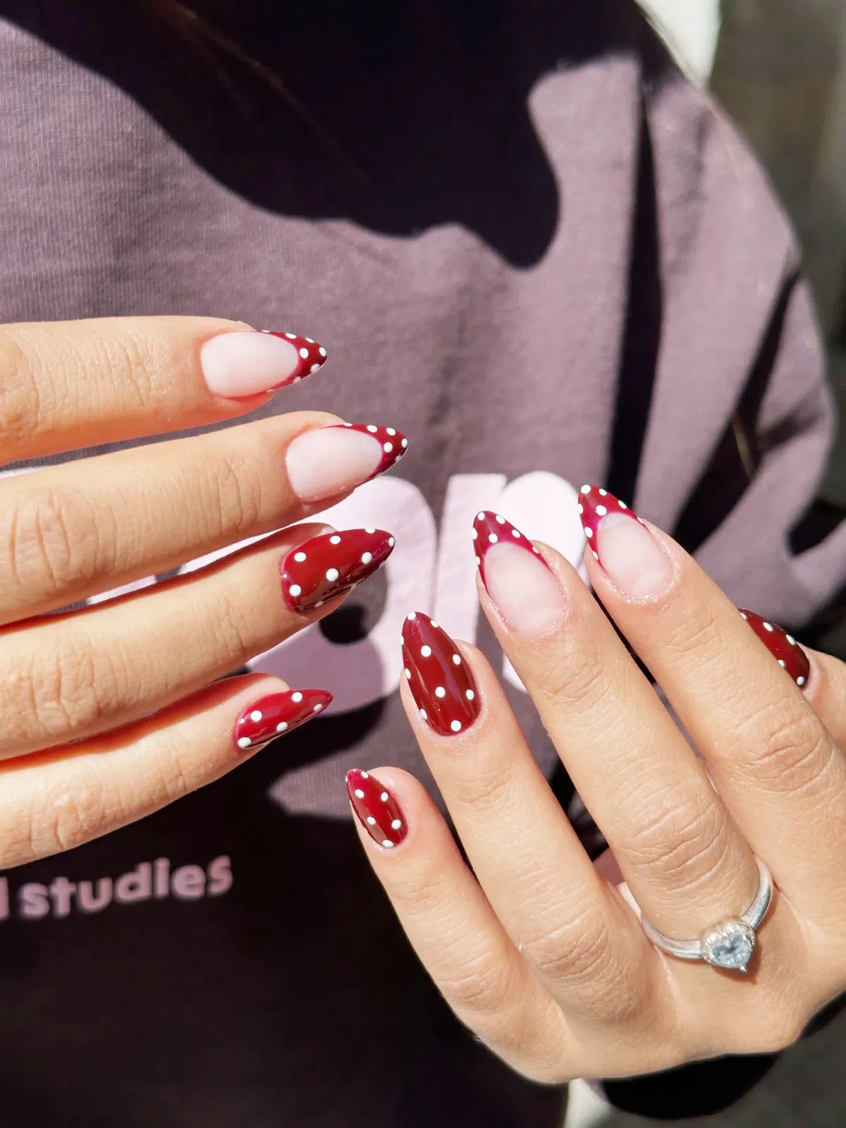 Red polka-dot French tips on nude base