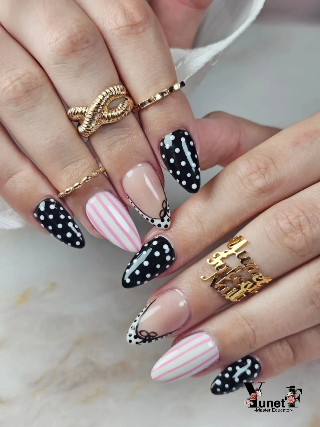 Black-and-white polka dots mixed with pink stripes and bow details