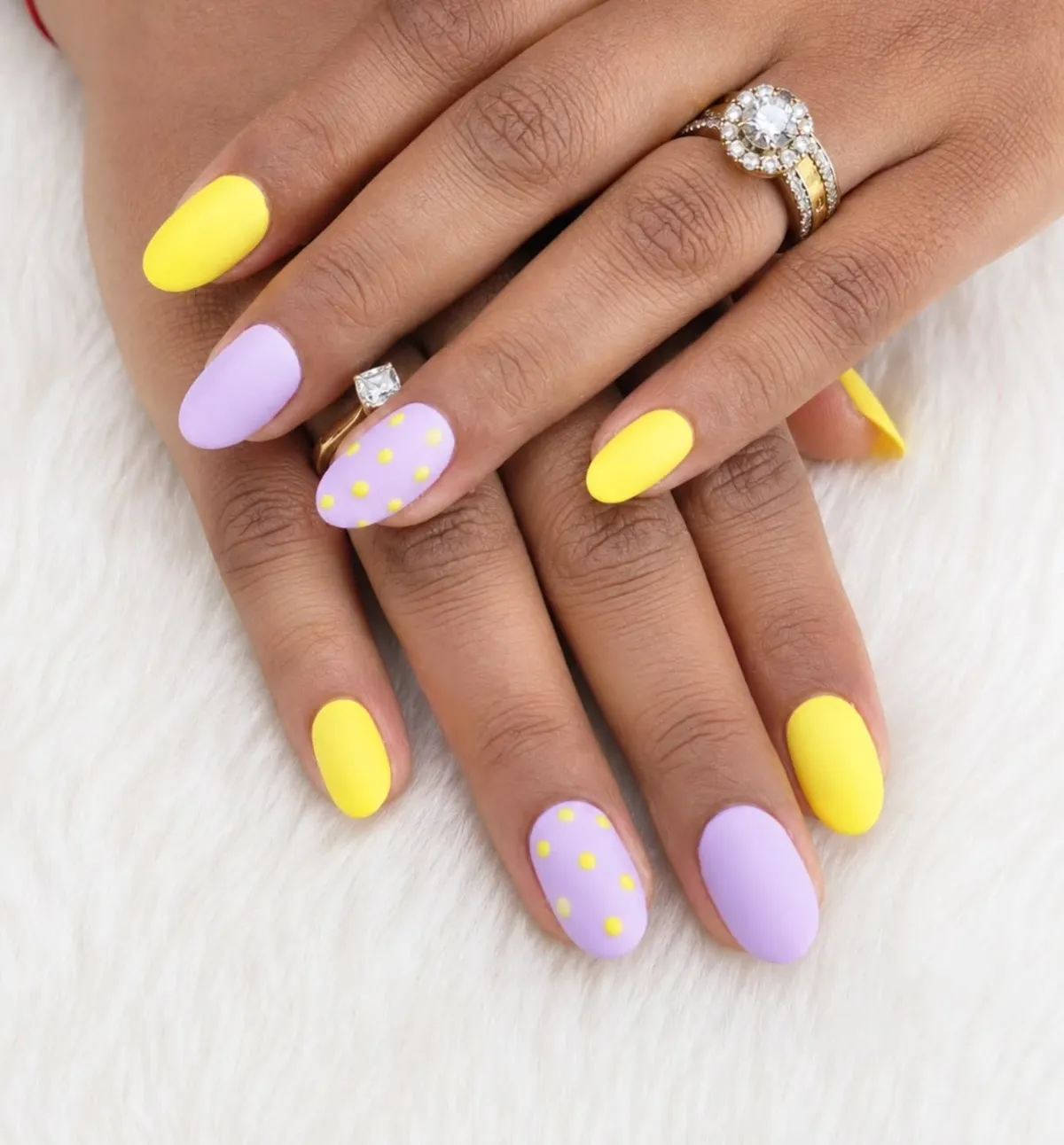 Matte yellow and lavender nails with yellow polka-dot accents