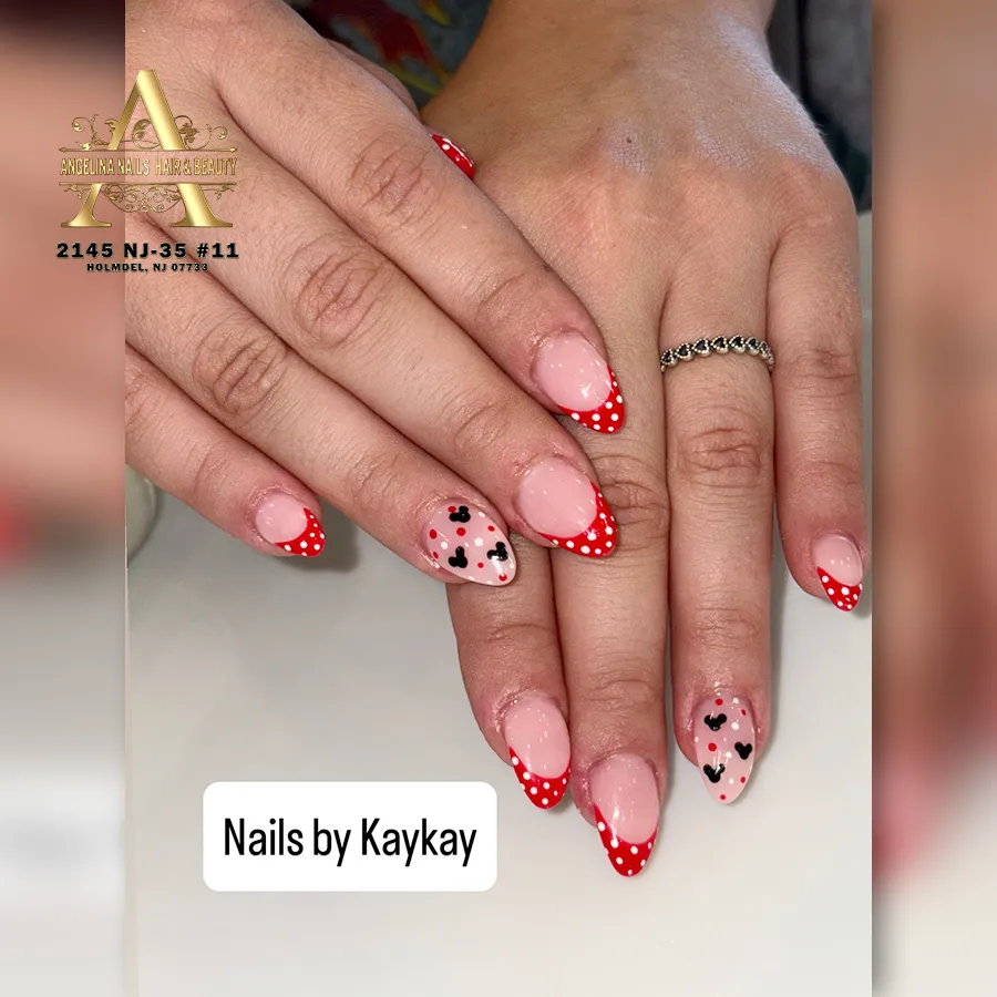 Red polka-dot French tips with heart-and-dot accent nails