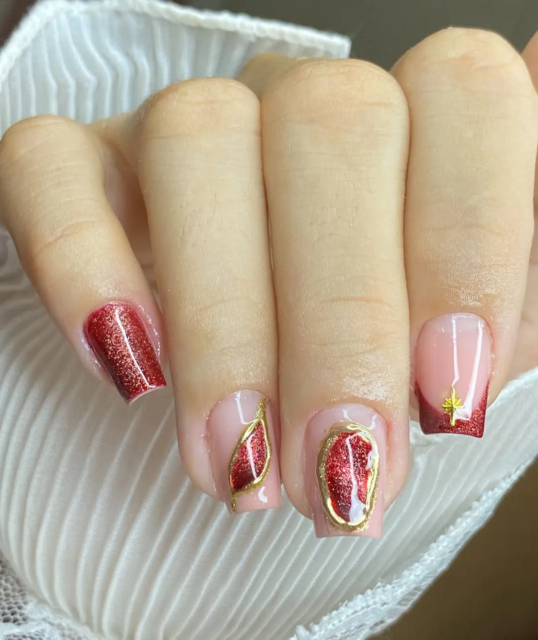 Red glitter accents with gold-toned outlines and star charm
