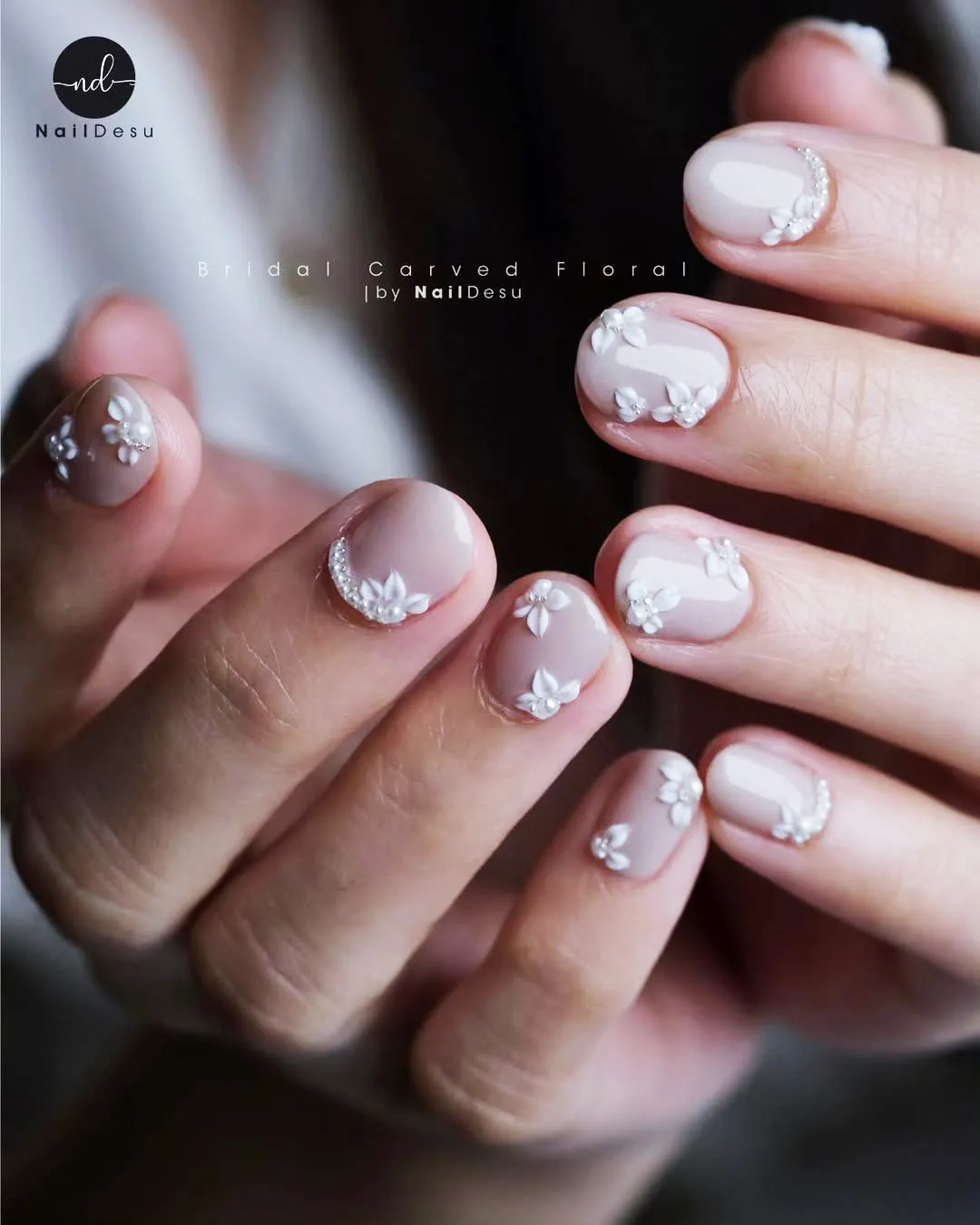 Pale nude-pink with carved florals and rhinestone arcs
