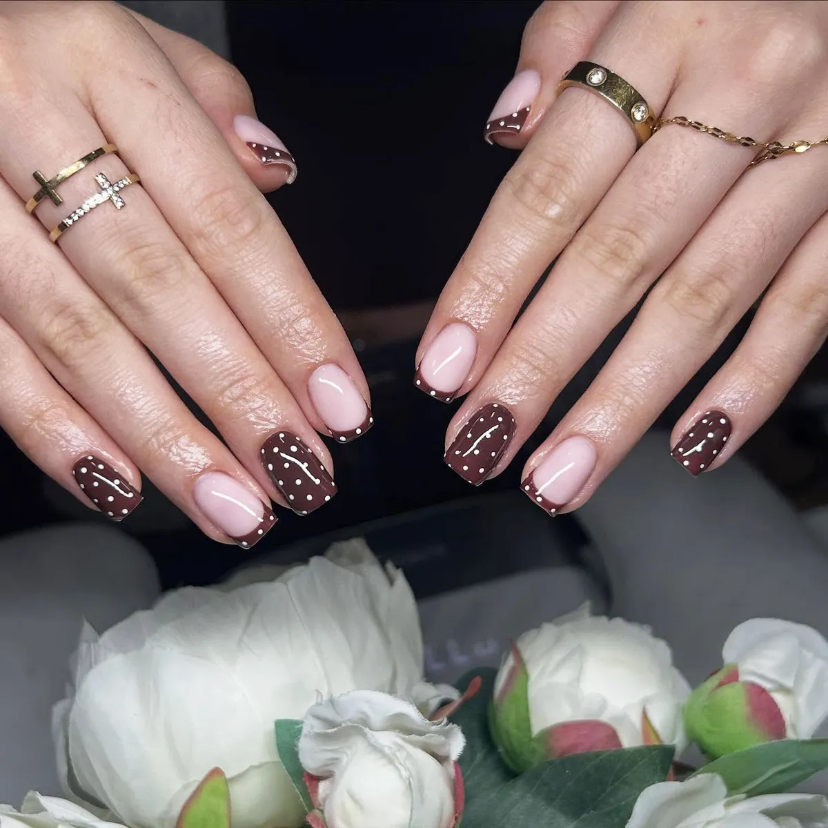 Brown polka dots and squiggles with dotted French tips