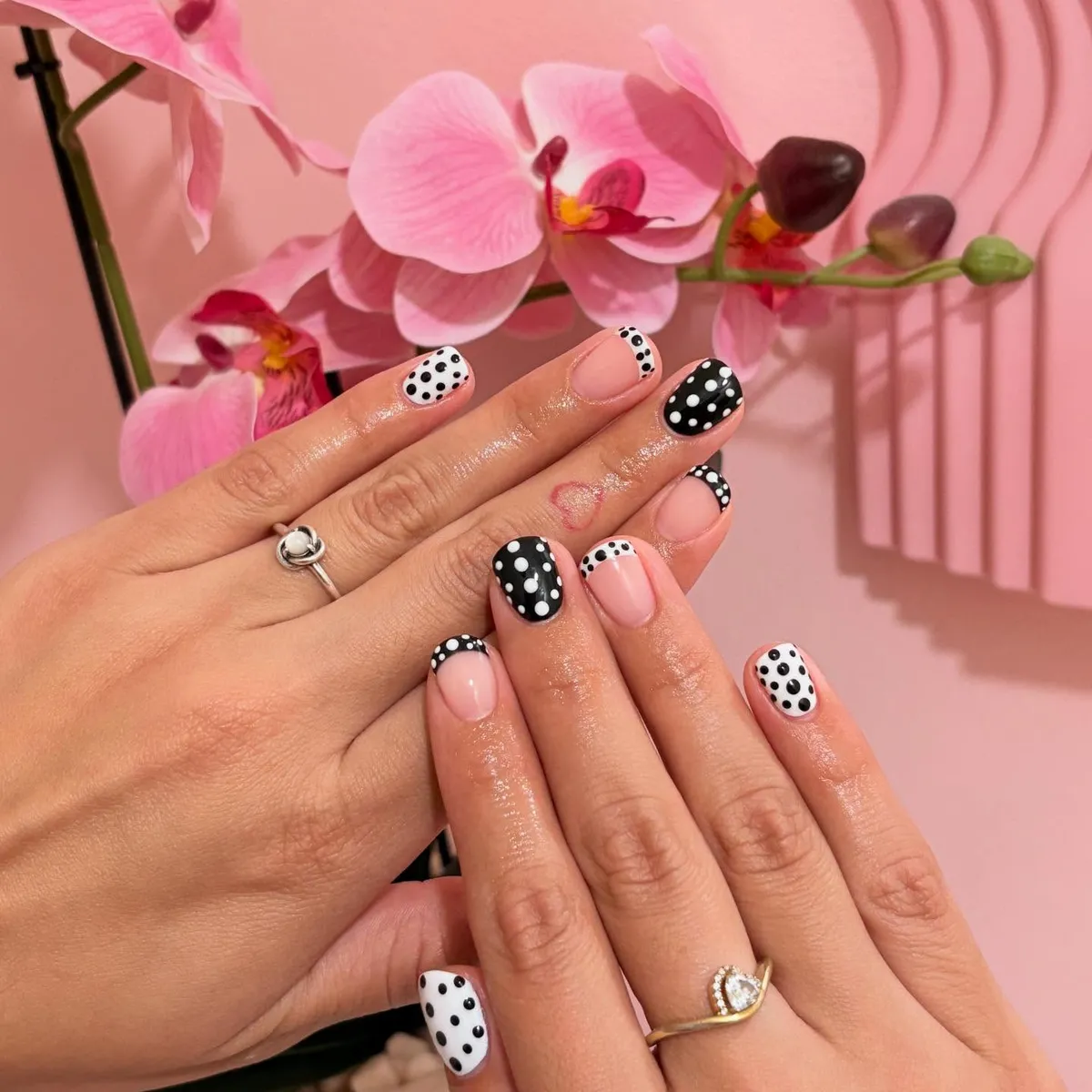 Classic black-and-white polka dots with dotted French tips