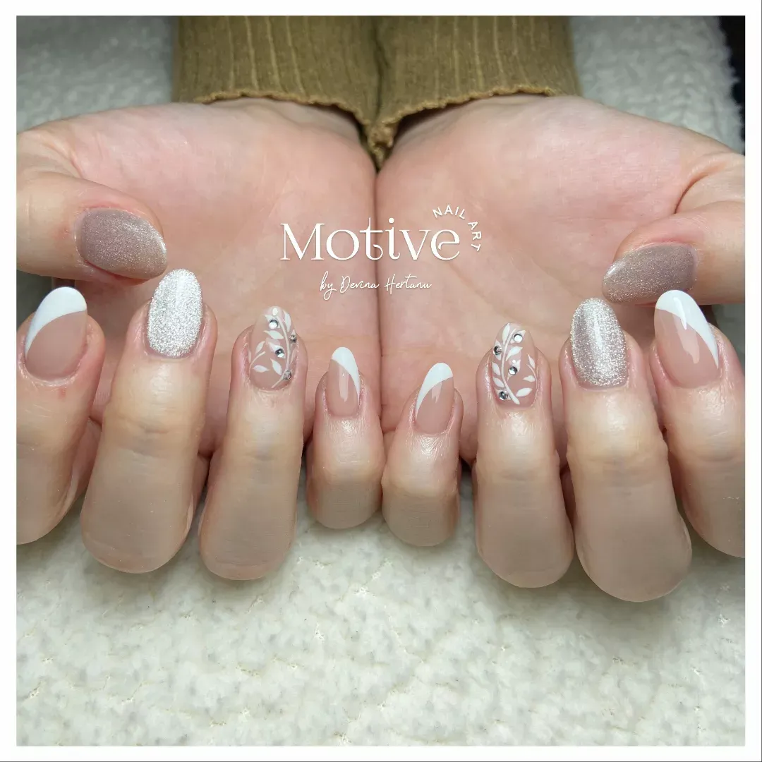 French tips with silver glitter and leaf accents