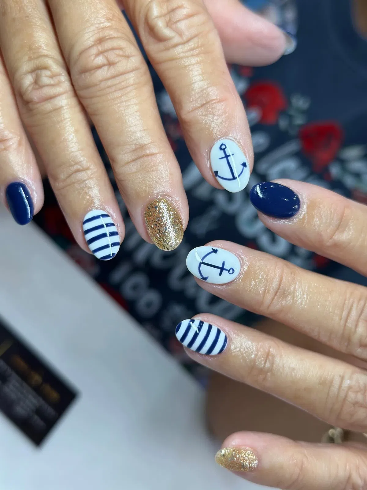 Nautical navy-and-white with anchor accents and gold sparkle