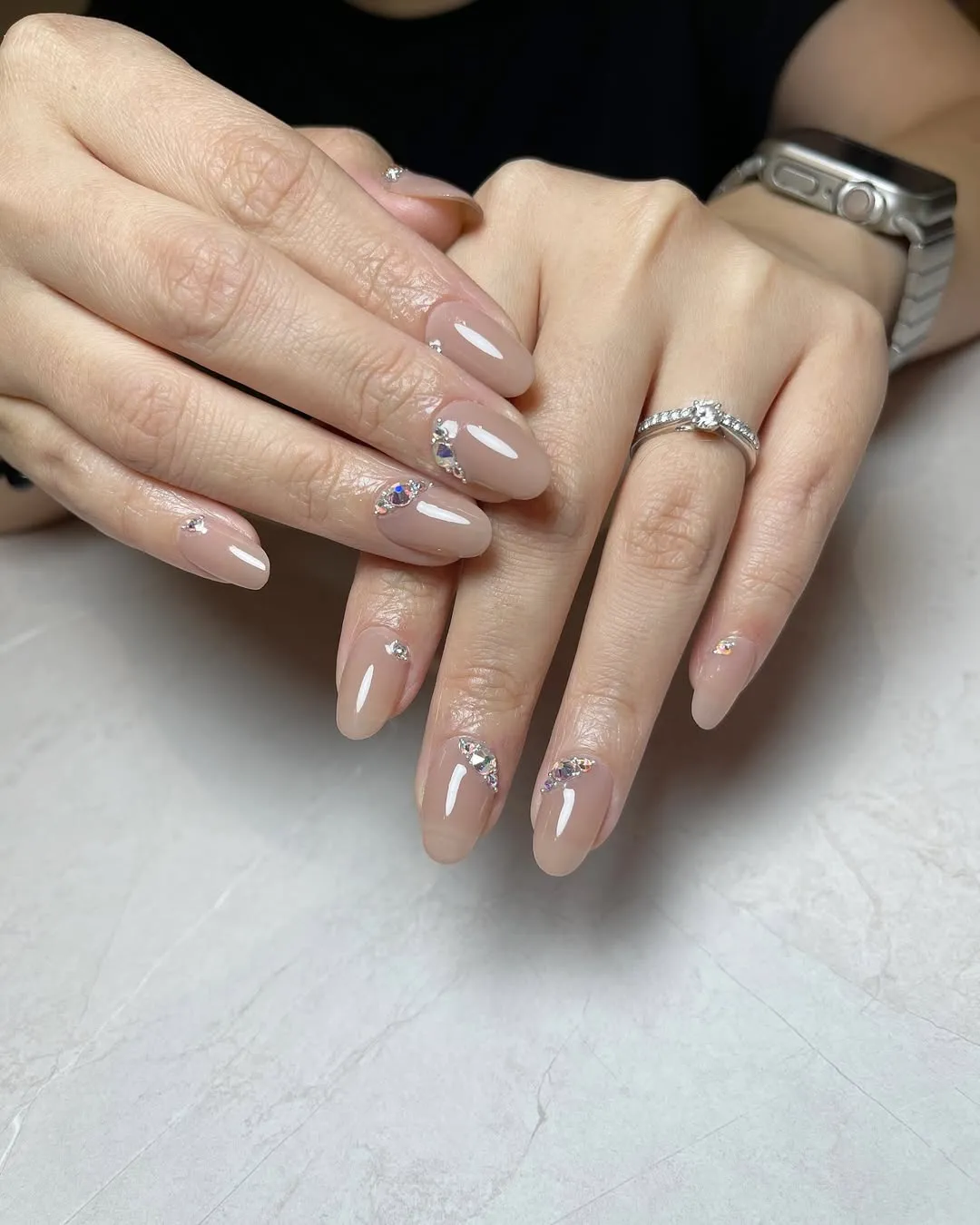 Nude-pink gloss with rhinestone cuticle accents
