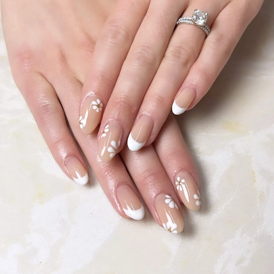 Micro French tips with small white flower accents