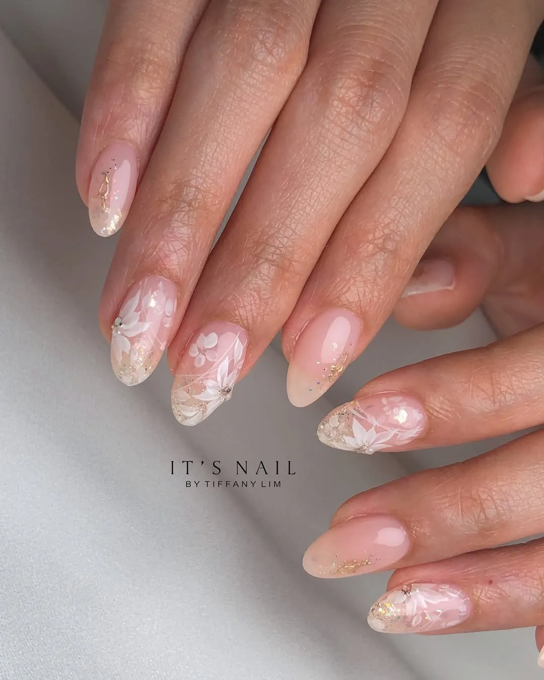 Sheer pink with white florals and glittery tips