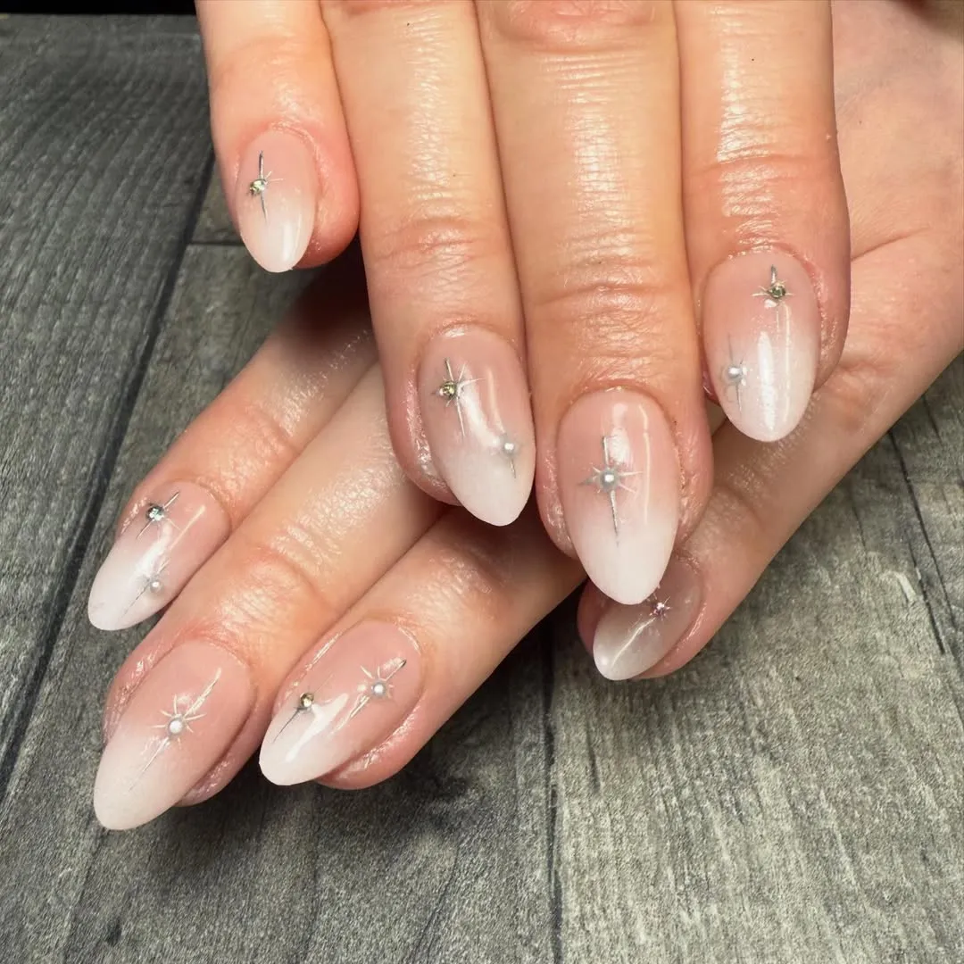 Nude-to-milky ombré with starburst accents