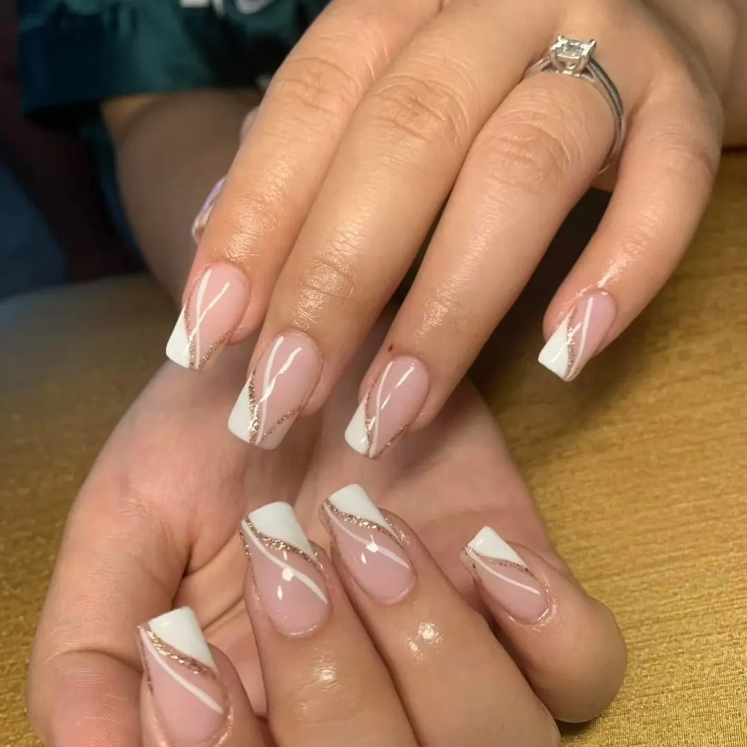 Diagonal white French tips with glitter stripe