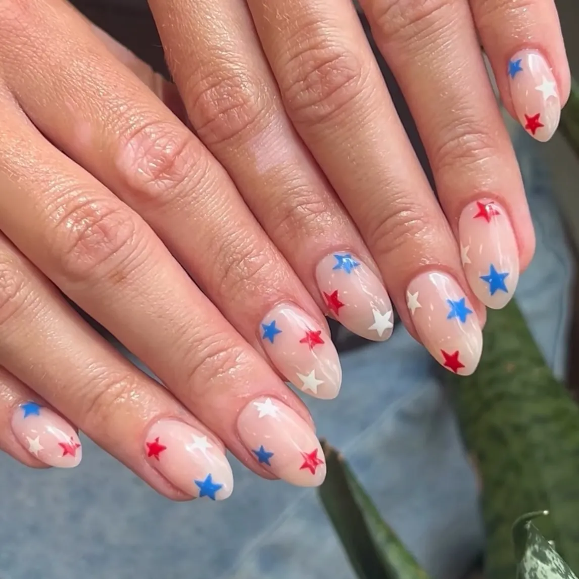 Sheer nude base with scattered red, white, and blue stars