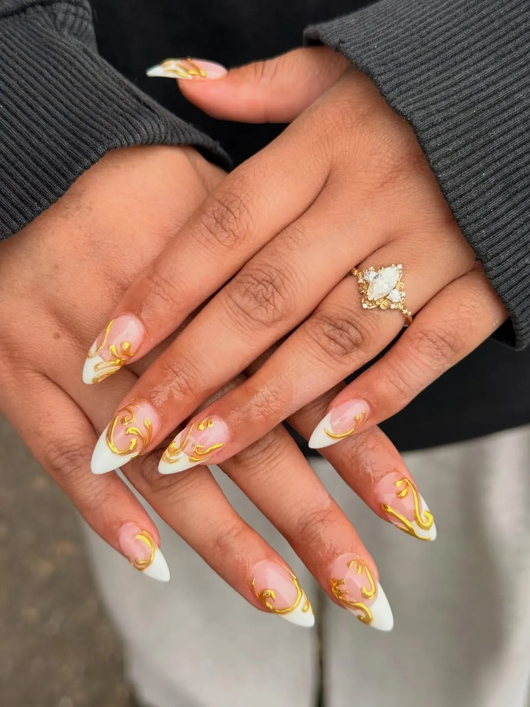 White French tips with raised gold scroll accents