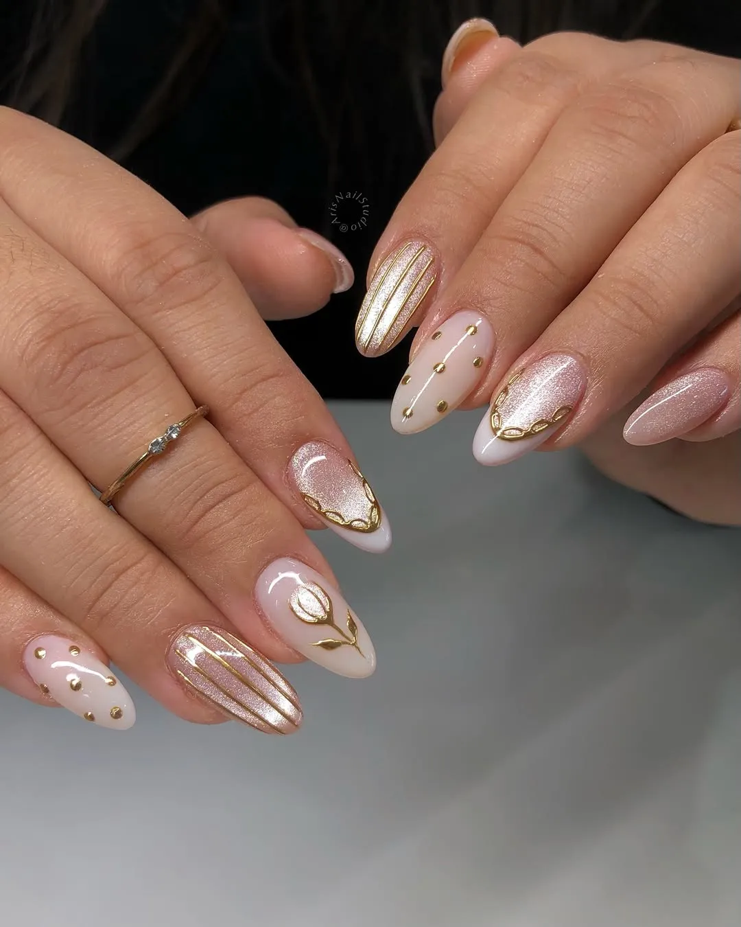 Pink shimmer and milky white with gold striping and studs