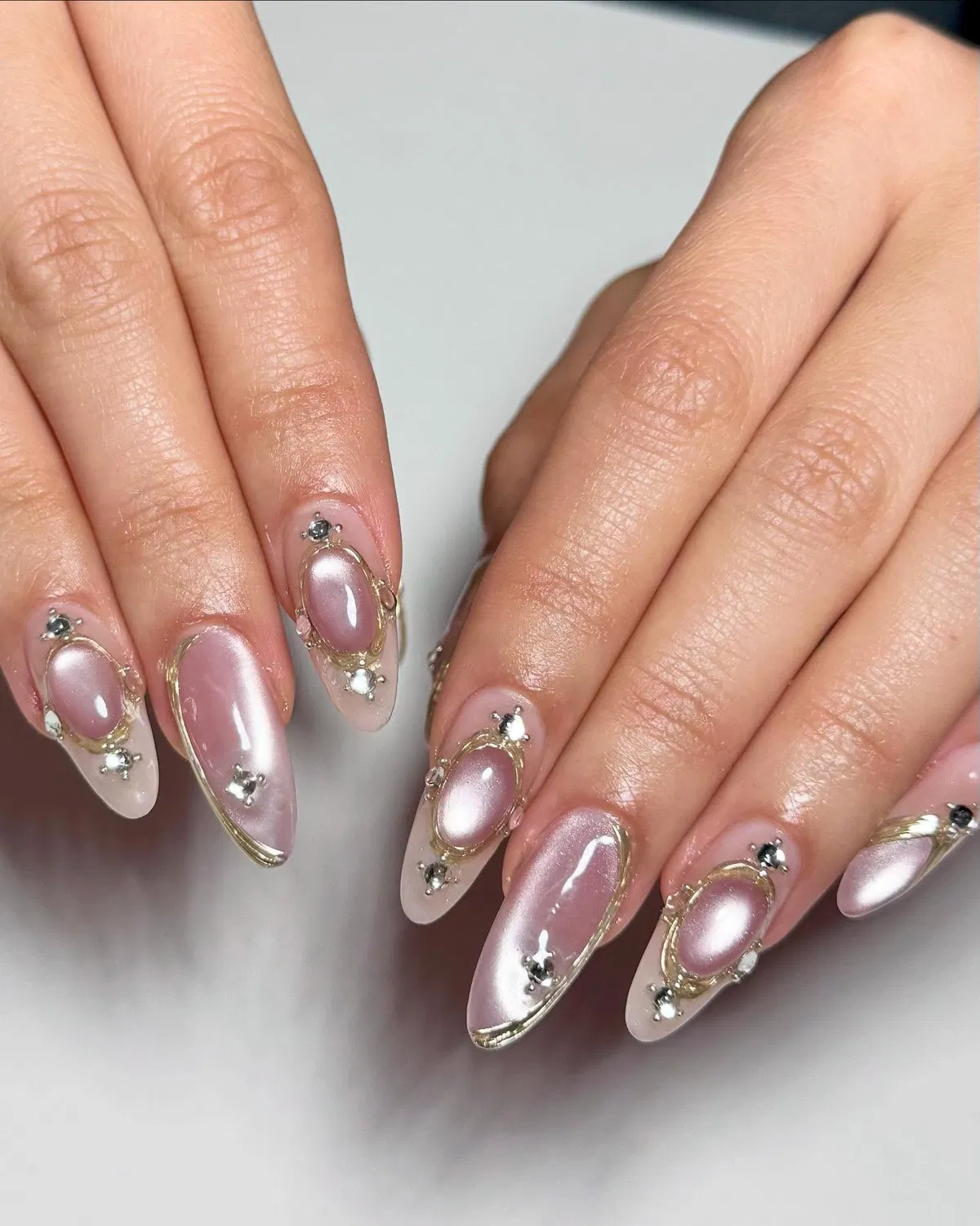 Pink pearly chrome with gold framing and rhinestones