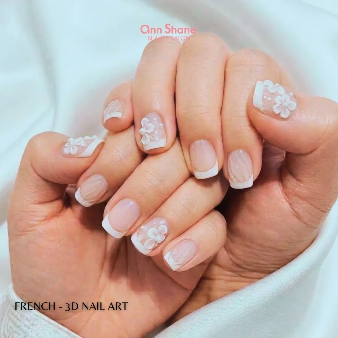 Short French tips with raised white flowers