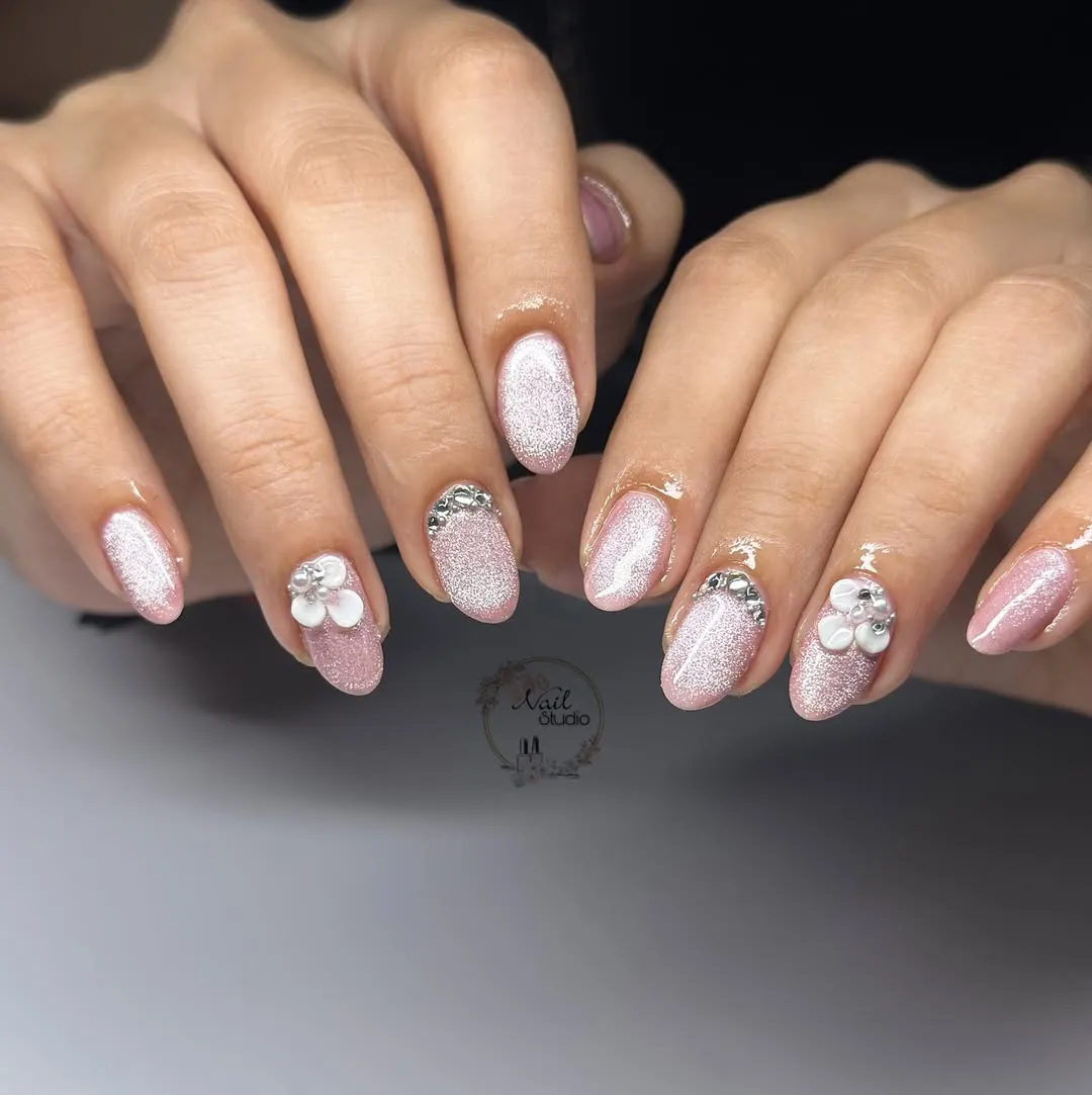 Shimmery pink almonds with rhinestones and 3D flowers