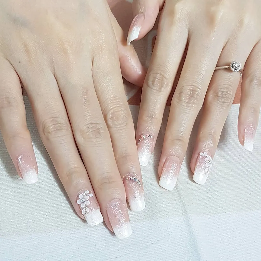 White ombre square nails with 3D flowers
