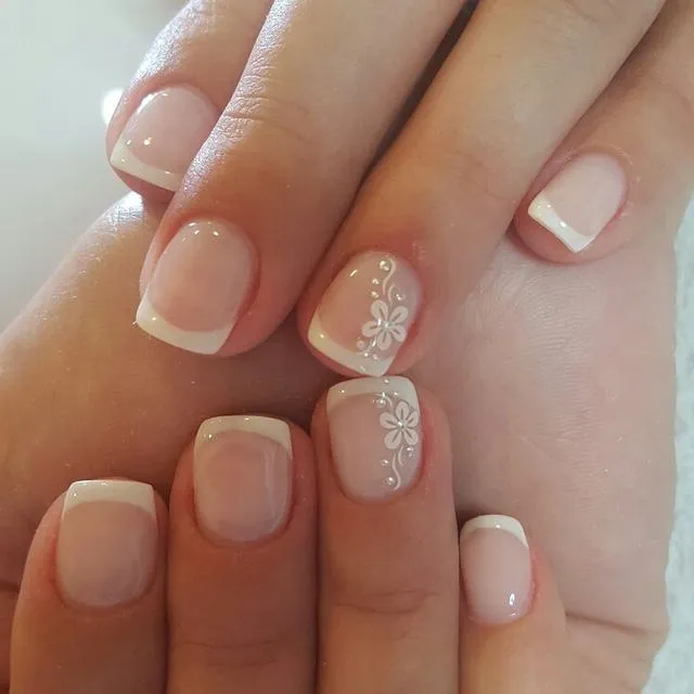 Short classic French tips with delicate white floral linework