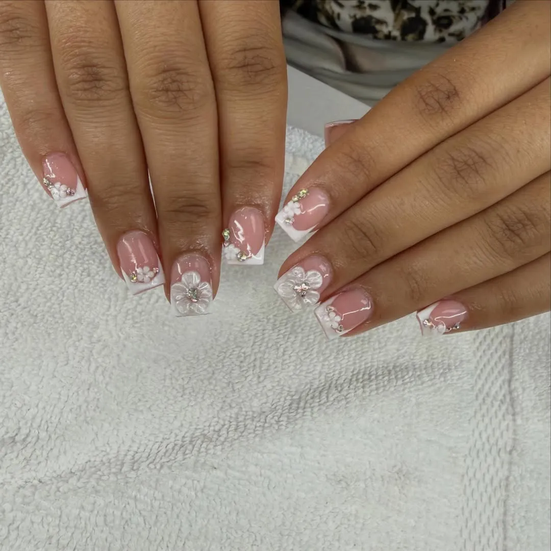 Pink square French tips with raised white flowers