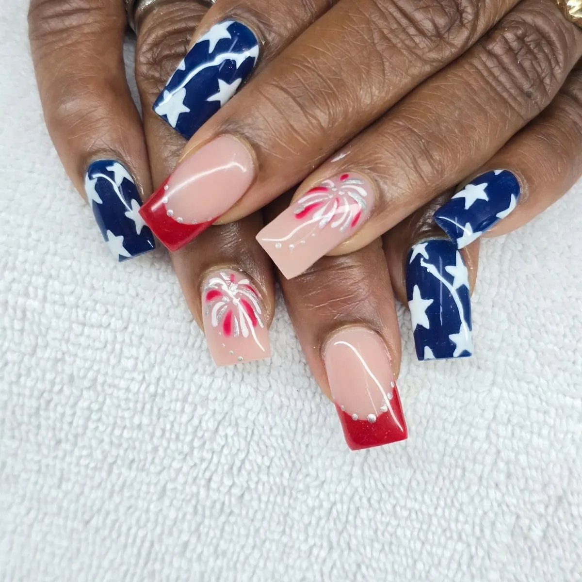 Navy star nails with red glitter French tips