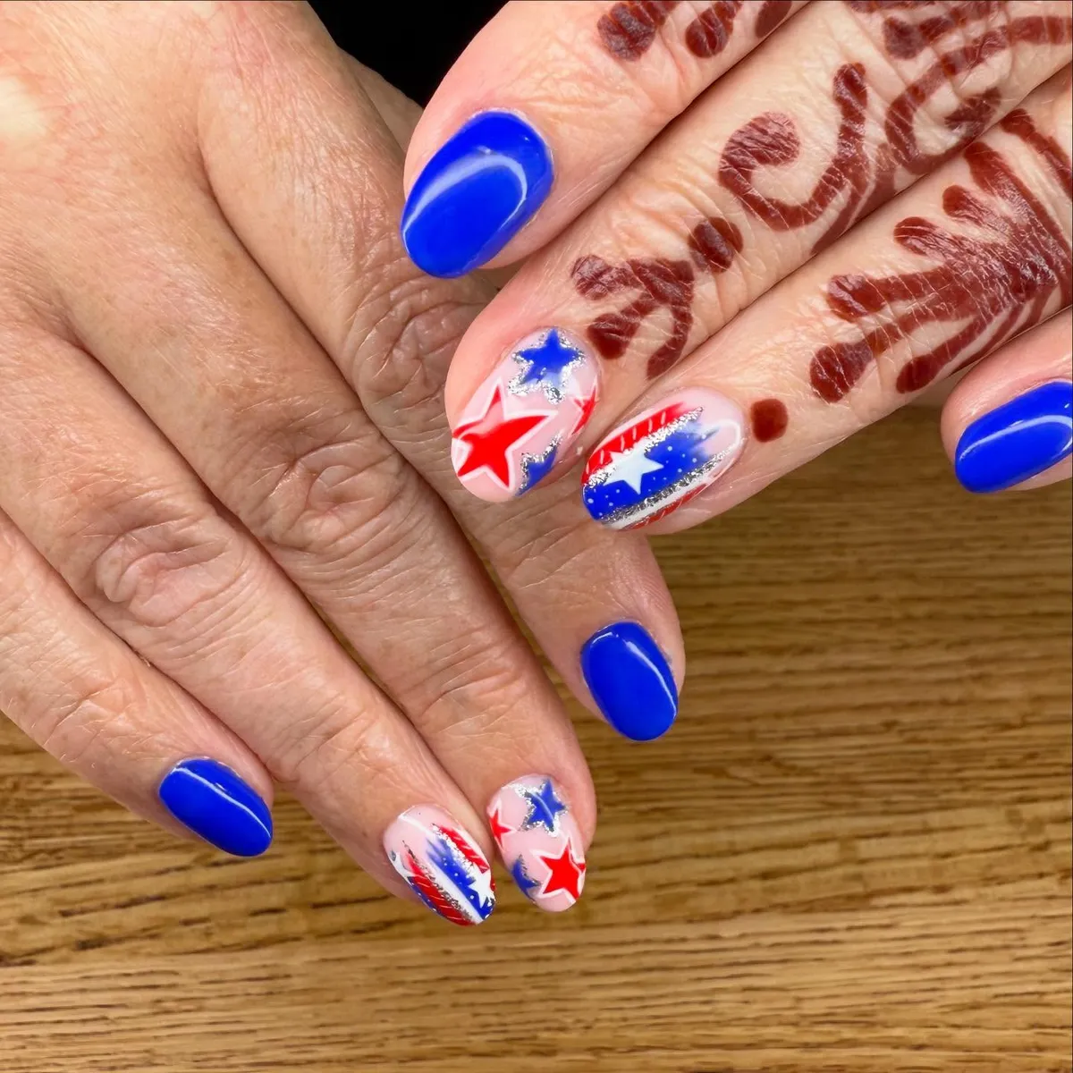 Bright blue nails with star accents