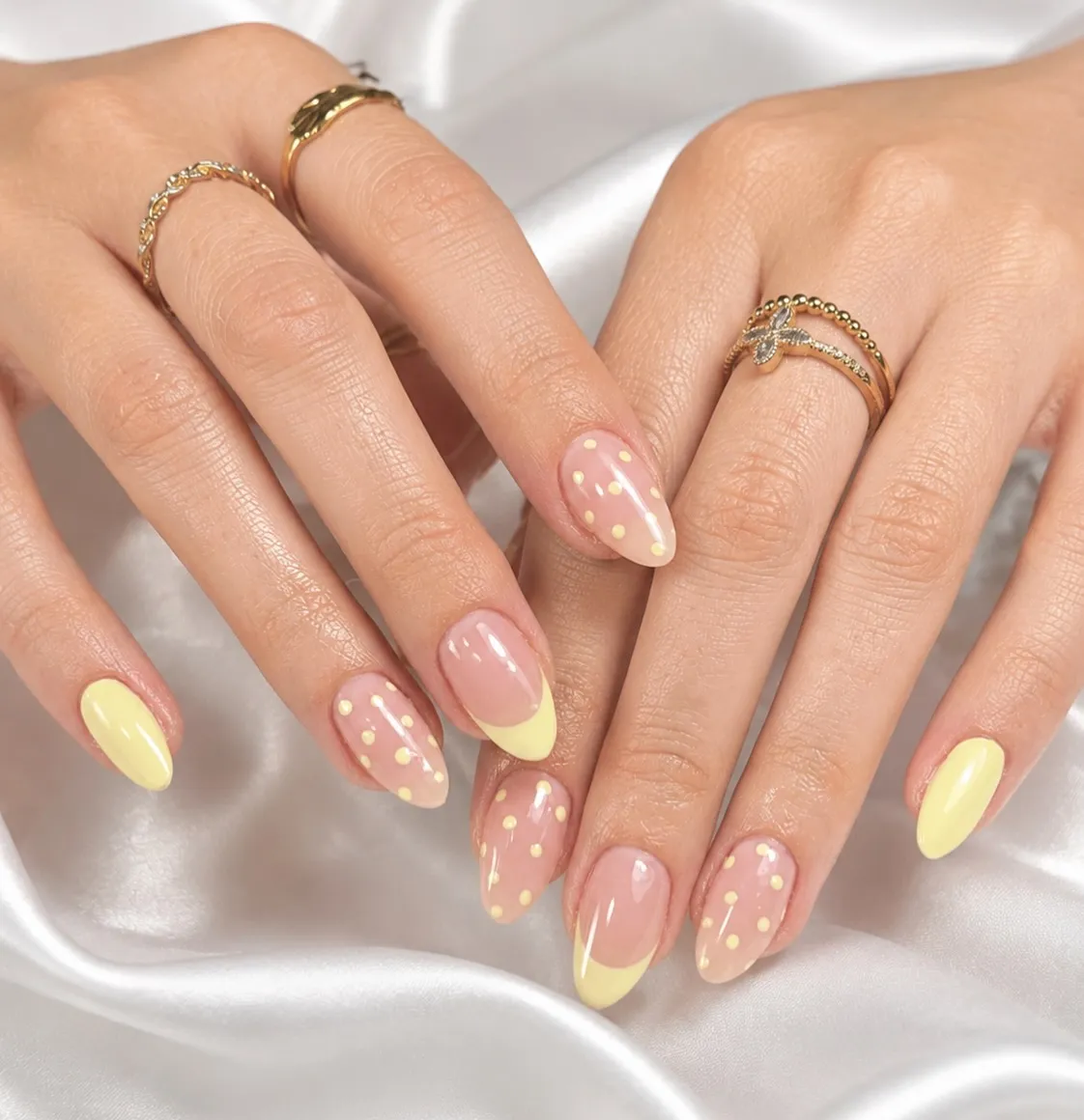Sheer pink with pale-yellow tips and pale-yellow polka dots