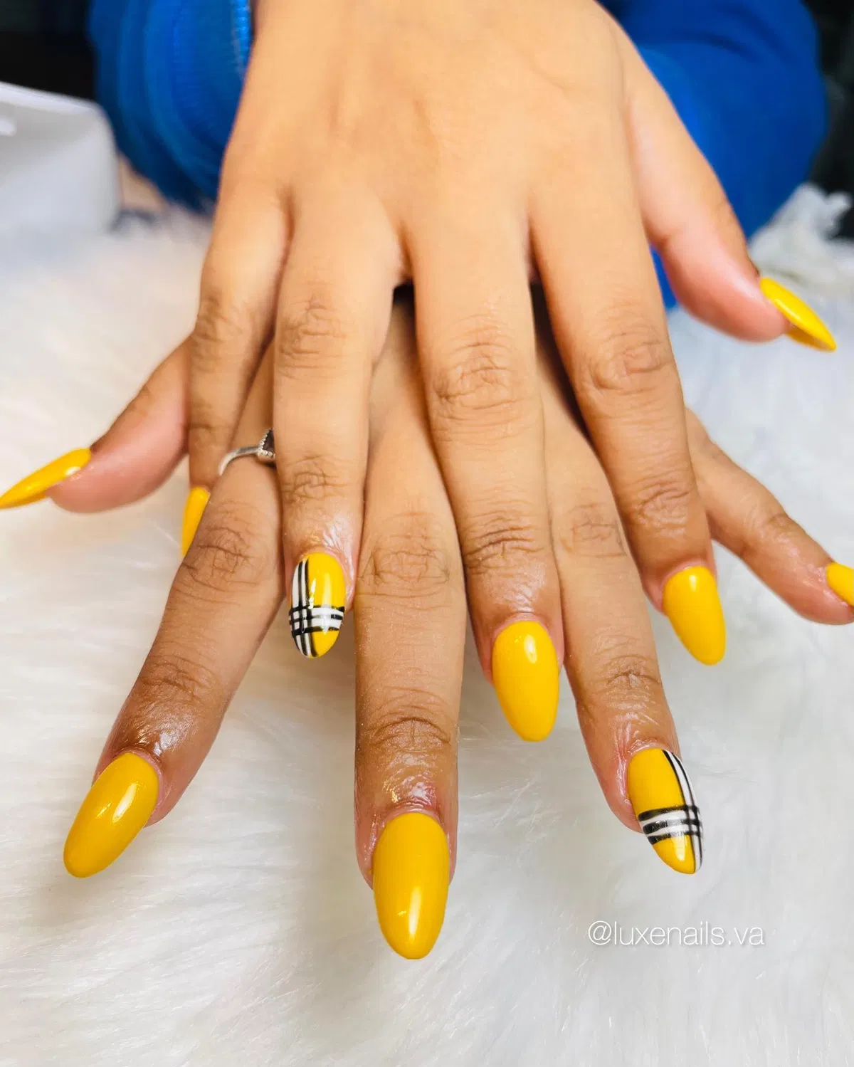 Bright yellow almond nails with plaid band accents