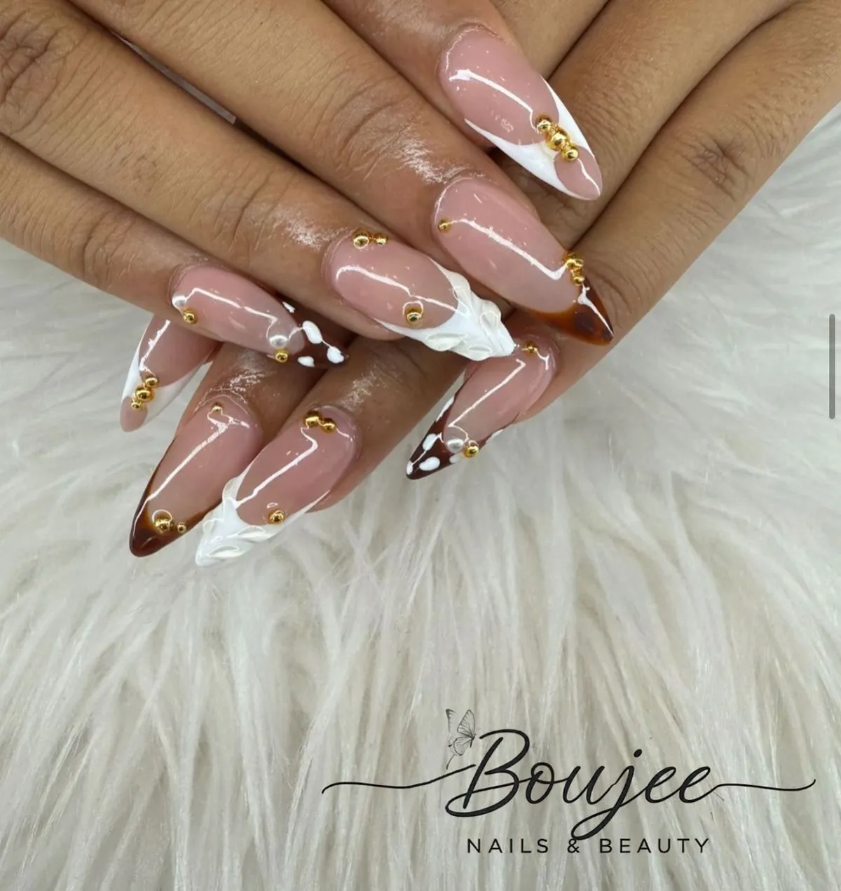 Nude stiletto set with brown tips, white accents, and gold beads