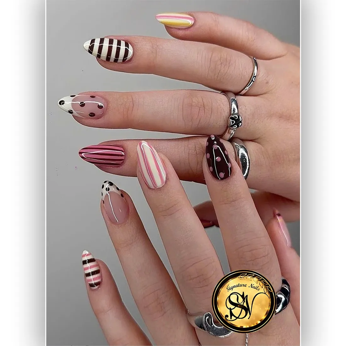 Mixed stripes and dots with pink, brown, and cream