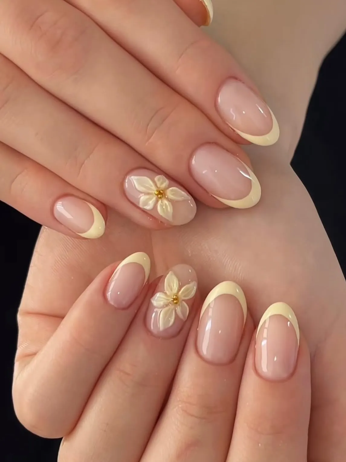 Short Baby Yellow French Tips with Raised White Flower Accent