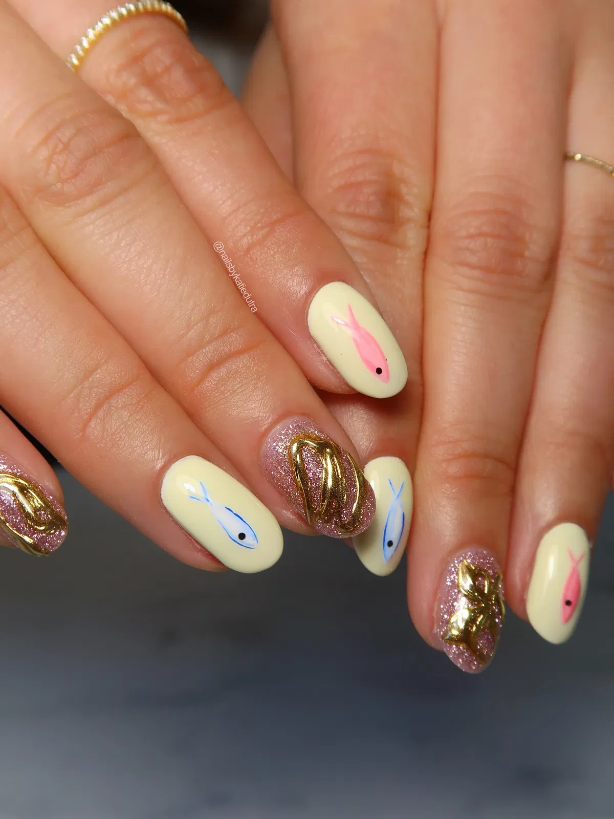Baby Yellow Fish Motifs with Glitter-and-Gold Accent Nails
