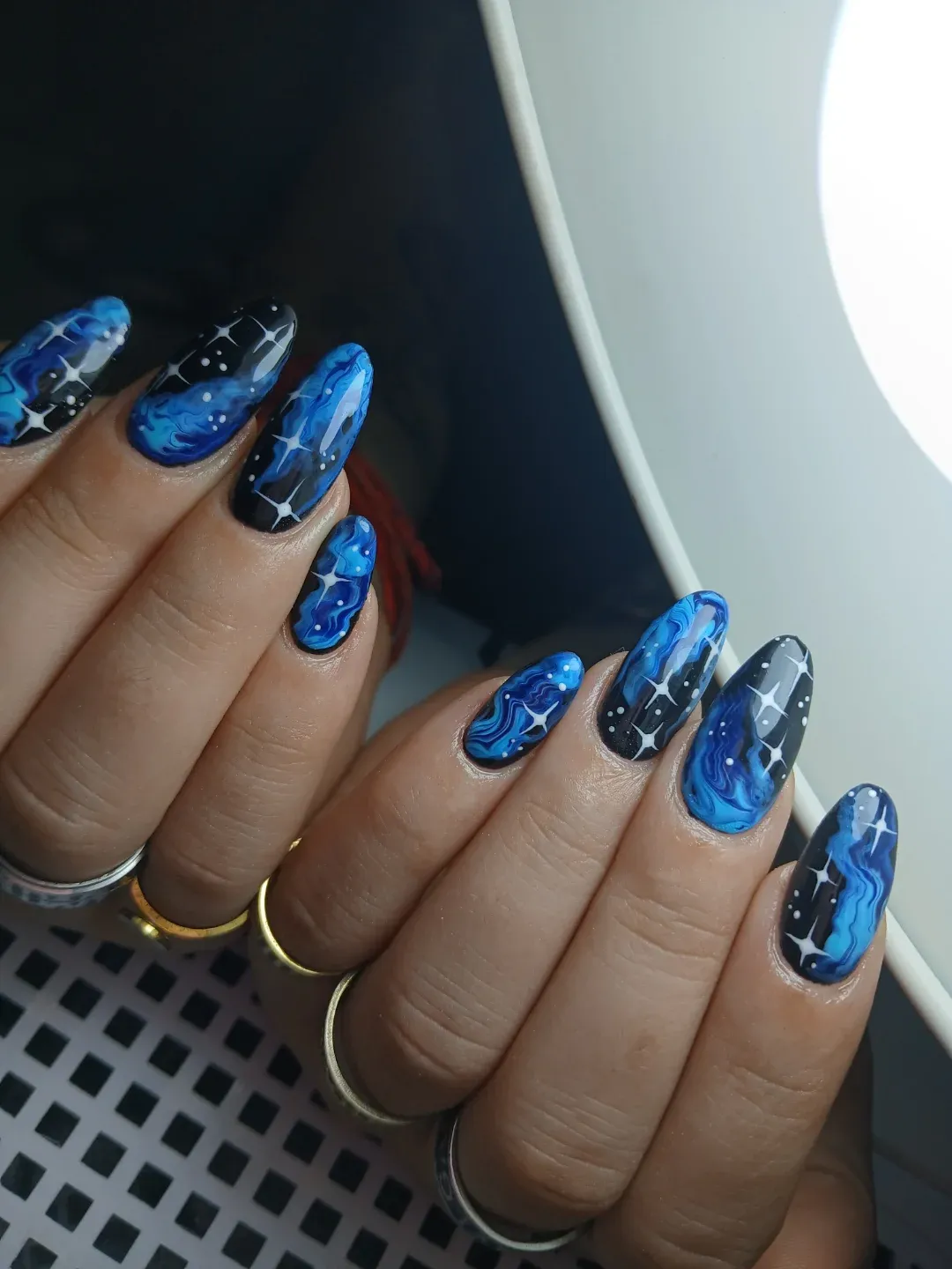 Blue marbling on black with starburst highlights