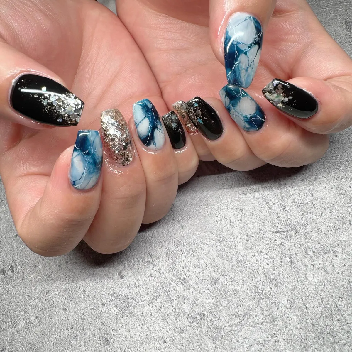 Black and blue marbling with silver foil-like accents