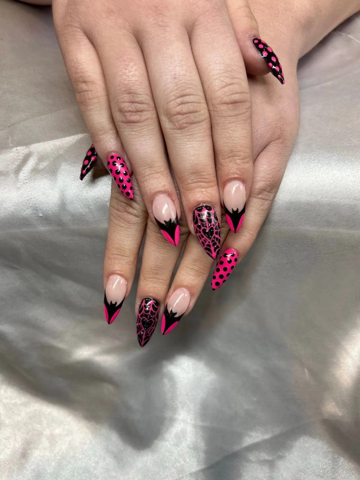 Glitter pink tips with stars, stripes, and spots