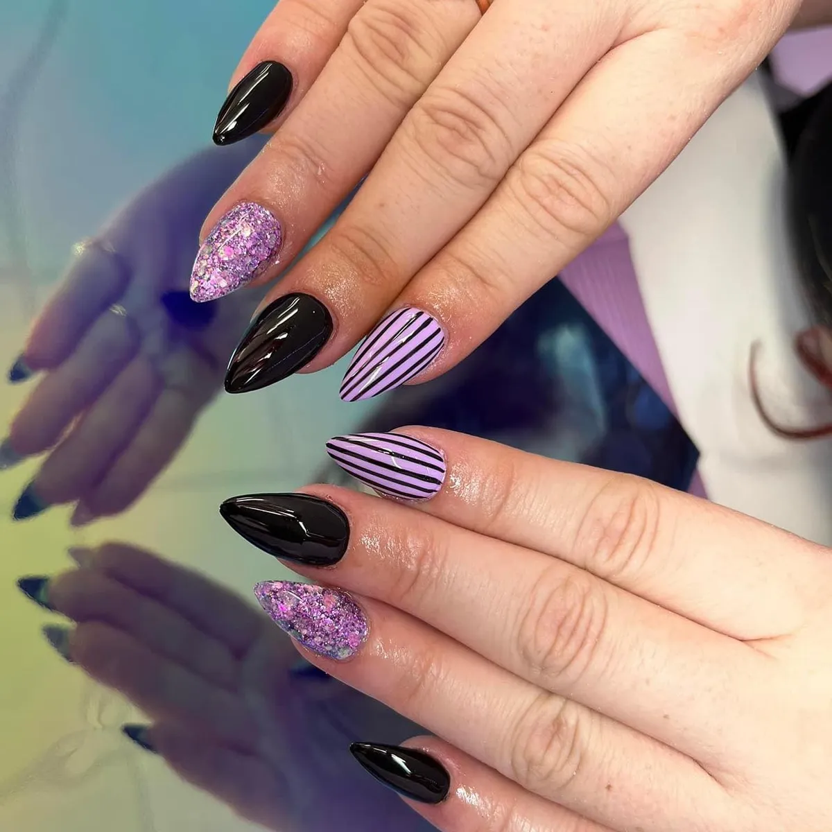 Glossy black with purple glitter and striped accents