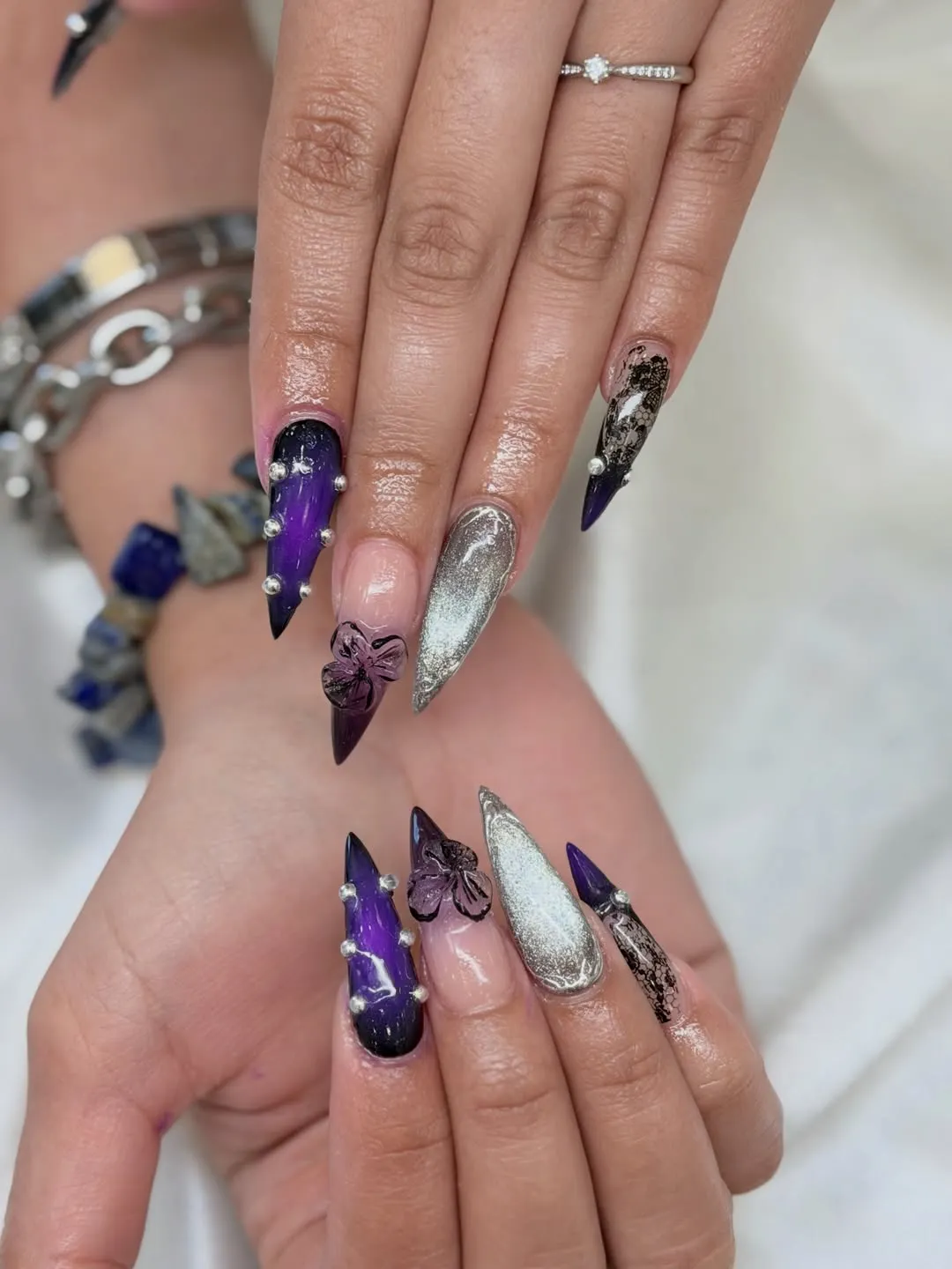 Purple-black gradients with silver and 3D floral accents