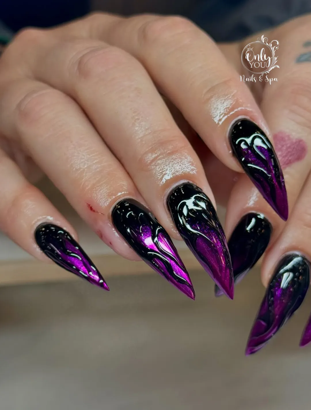 High-gloss black with vivid purple metallic accents and white outlines