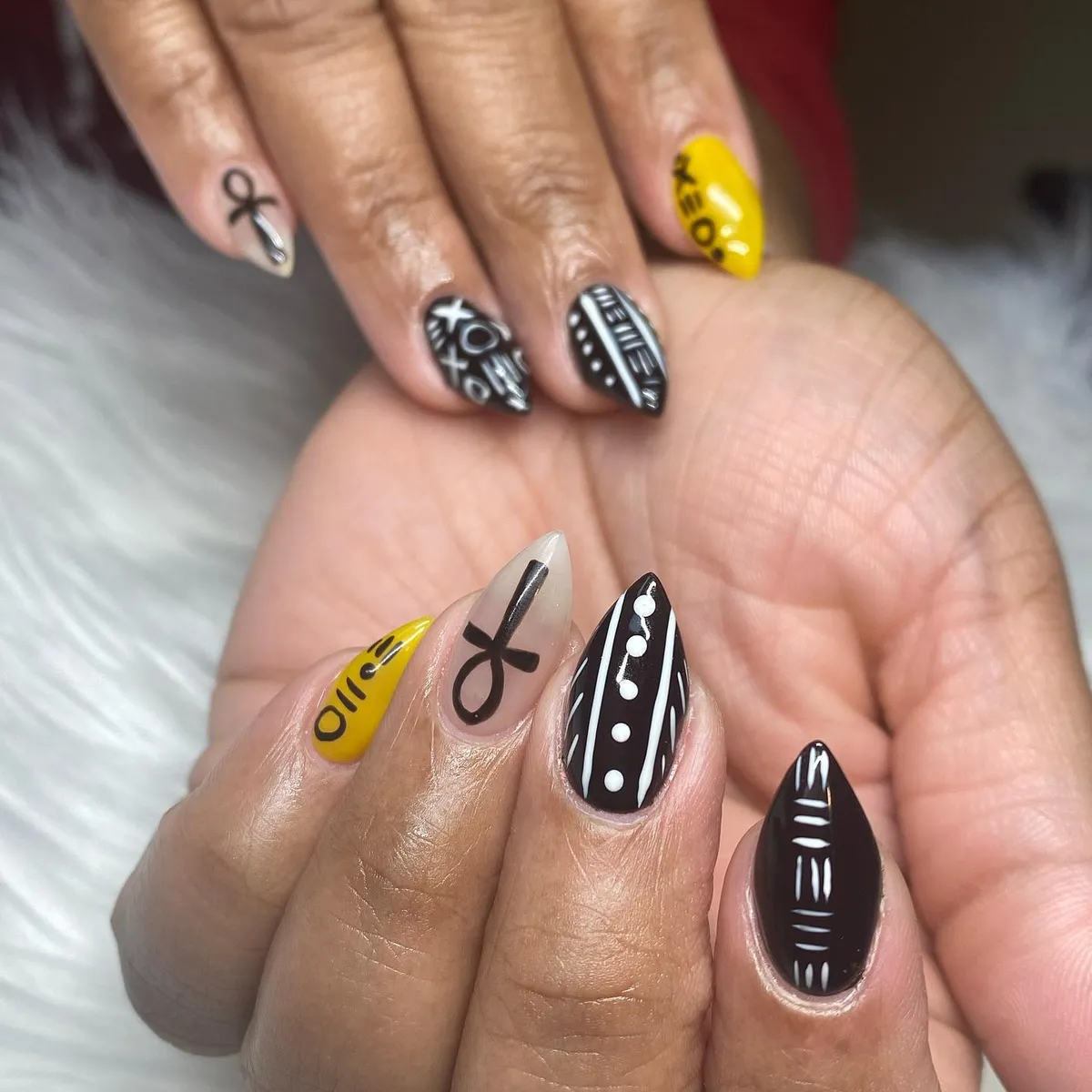 Graphic black-and-white patterns with yellow text accents