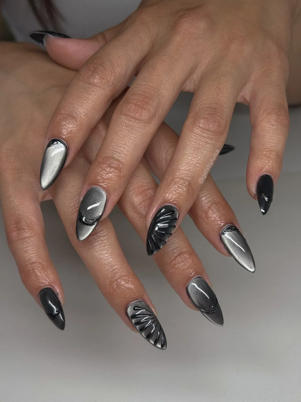 Black–Silver Cat-Eye with Raised 3D Grooved Accents