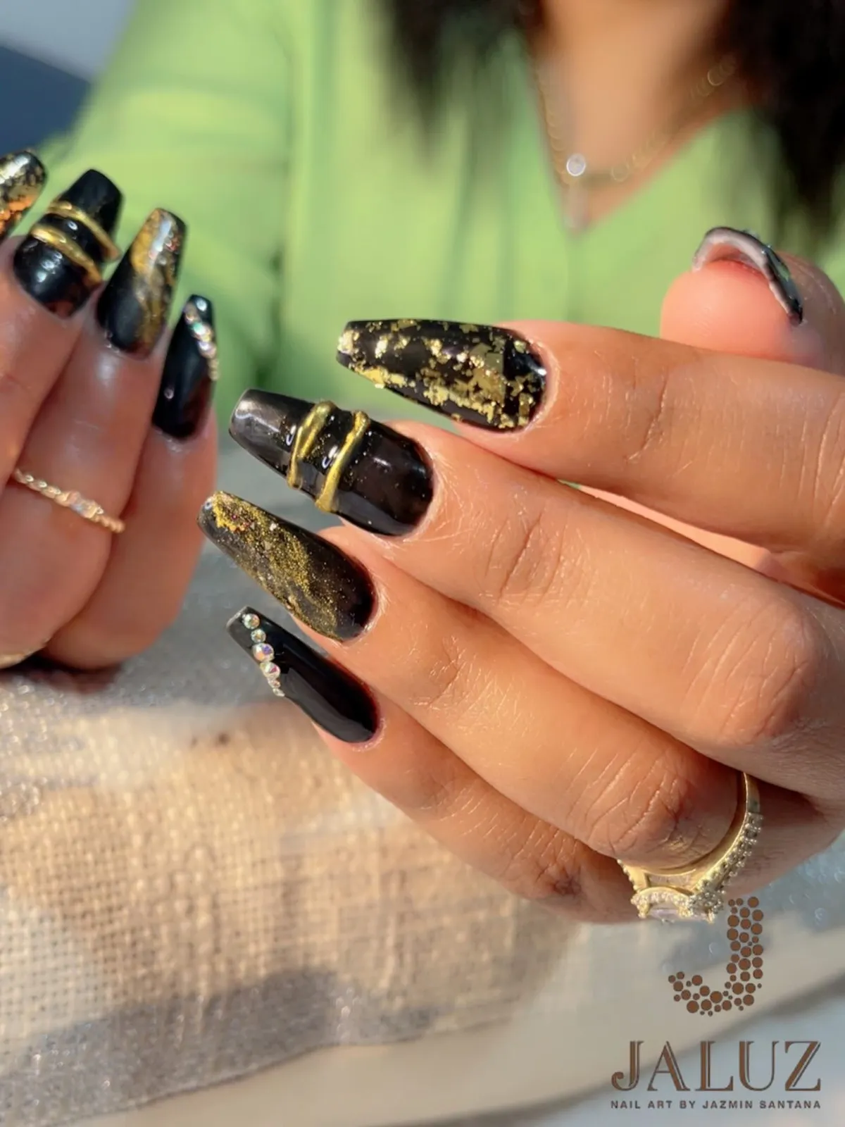 Glossy black with gold foil and raised gold bands