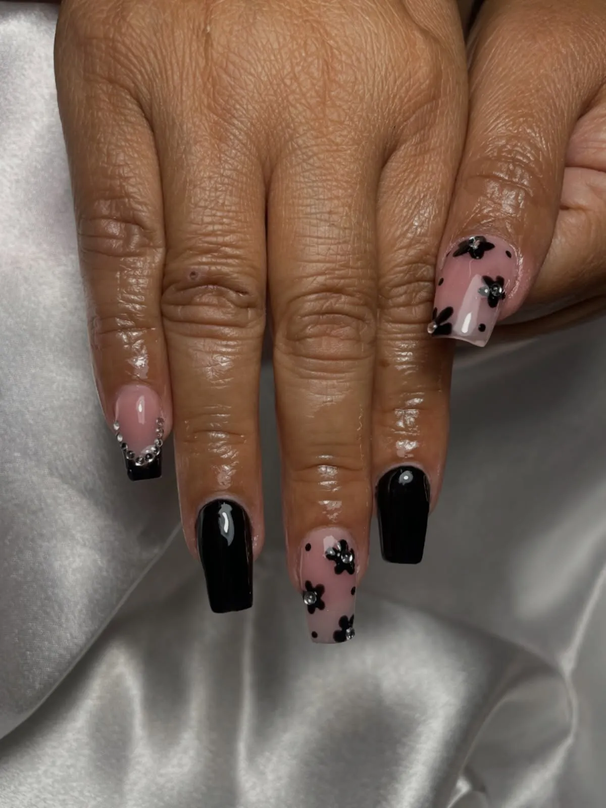Black solids with mauve floral accent nails