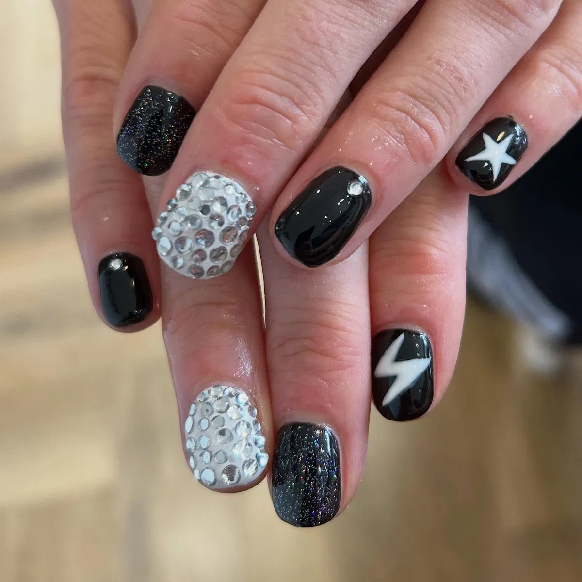 Black glitter with star, lightning, and rhinestone accents