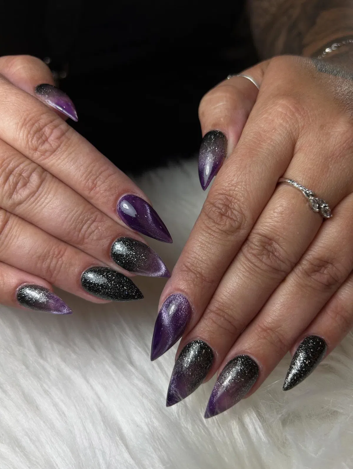 Purple-to-black glitter gradient stiletto nails