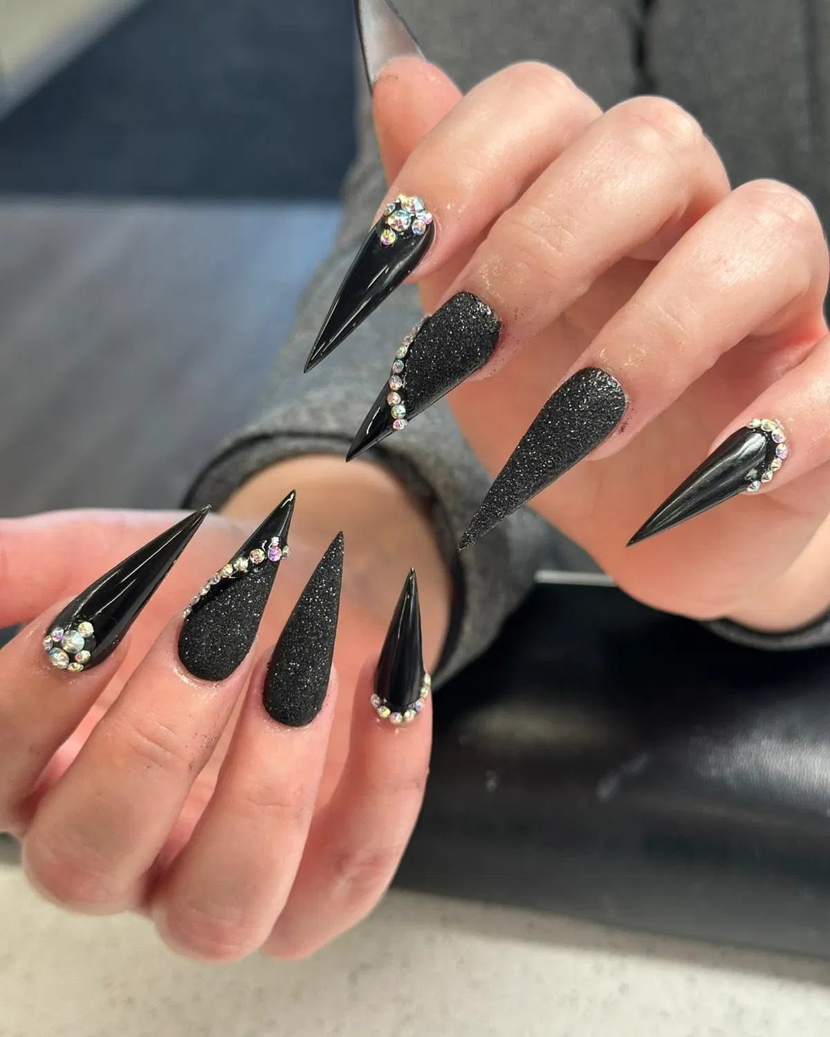 Mixed-finish black stilettos with crystal edging