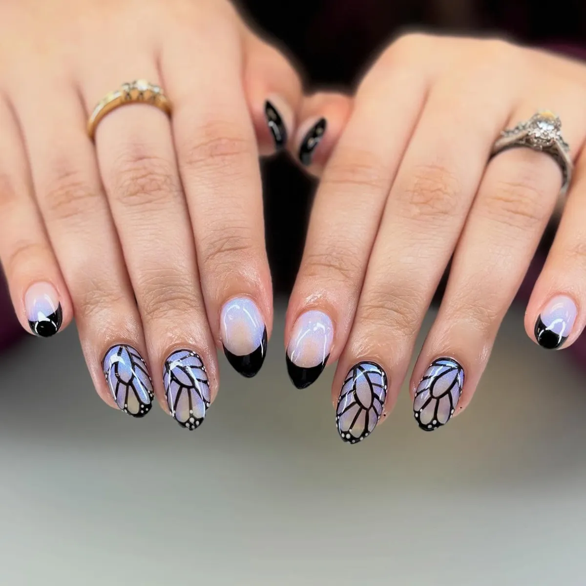Black tips with lavender wing-like graphic accents