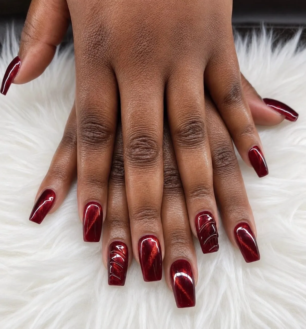 Glossy deep red squares with subtle line accents