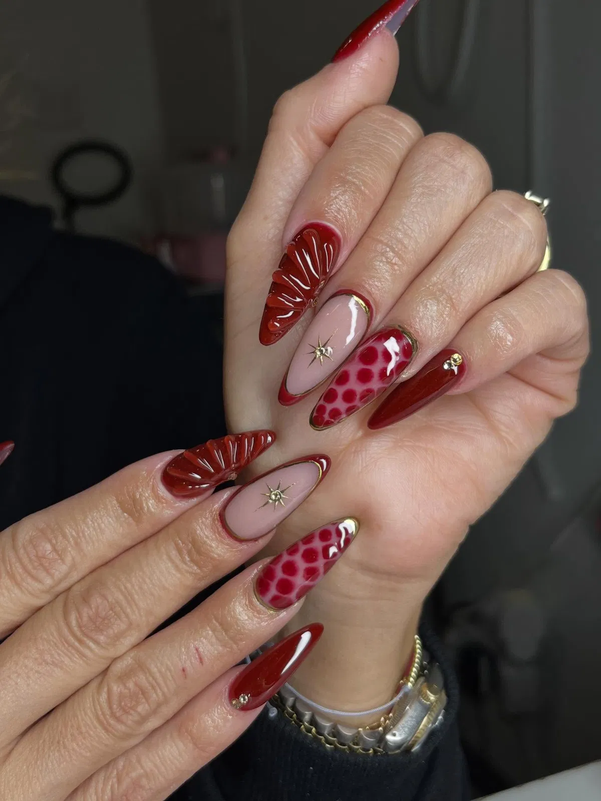 Stiletto reds with gold edging, spots, and 3D accents