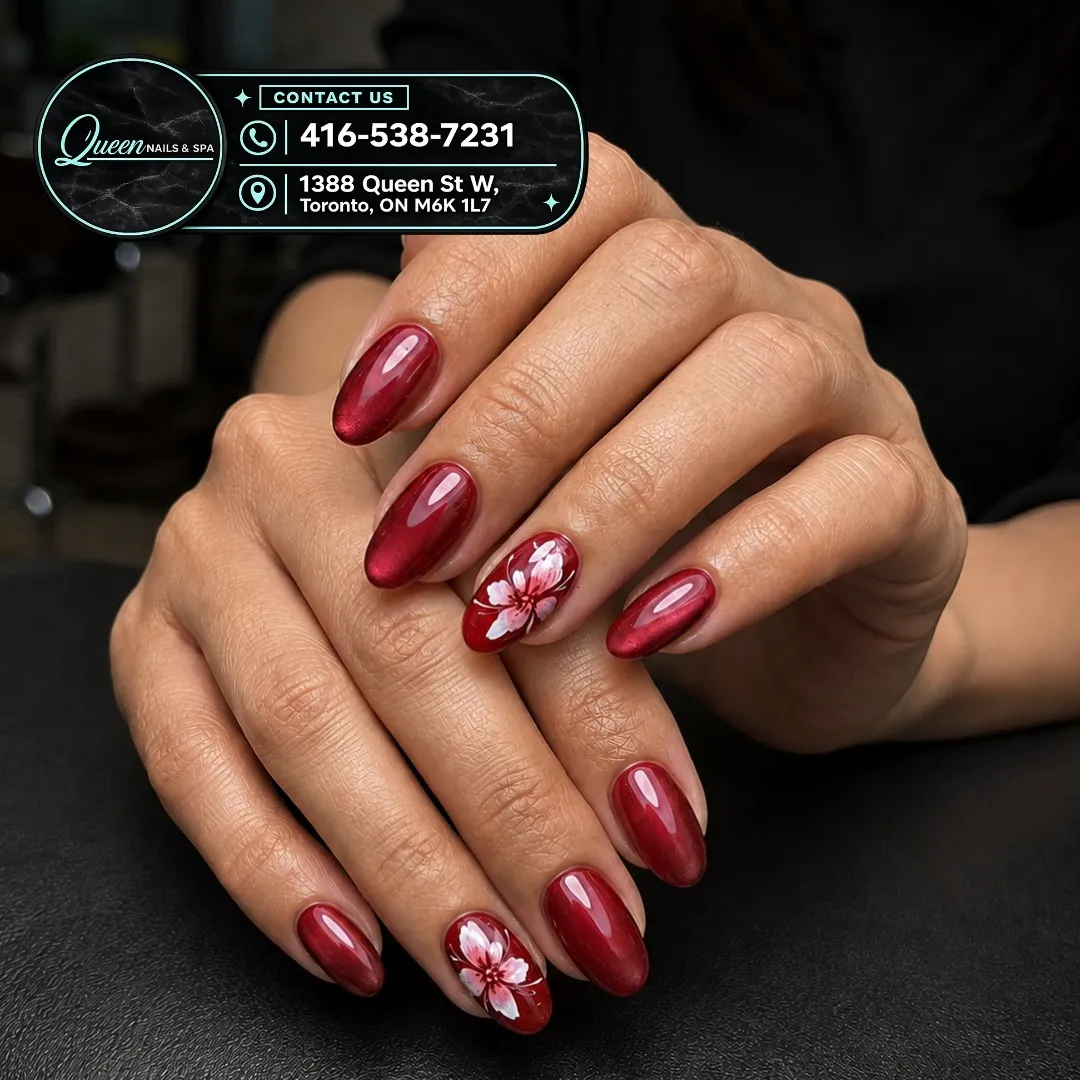 Deep red glossy nails with white-pink floral accents